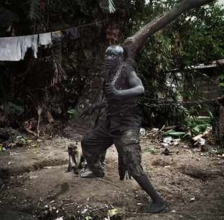 Illustration for article titled You and I will never look as bad-ass as these Congolese magician-wrestlers